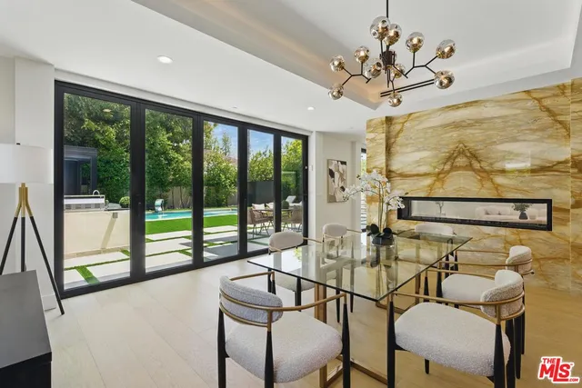 a kitchen with stainless steel appliances granite countertop a sink and a stove