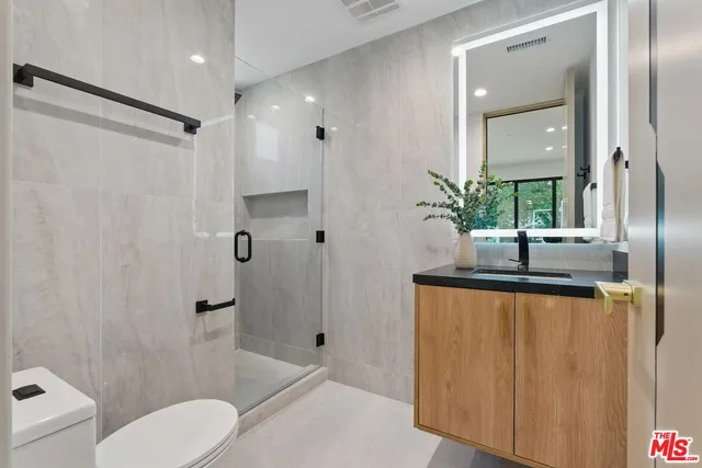 a living room with furniture and large windows