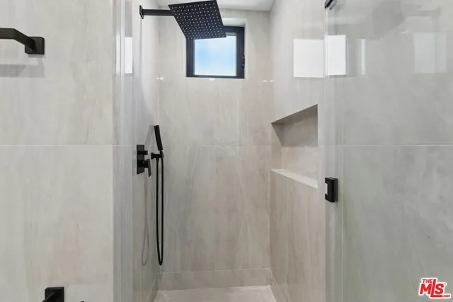 a view of a hallway with a glass door