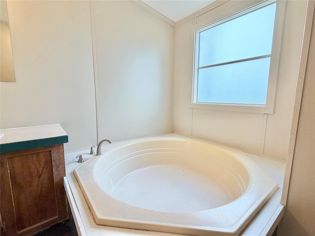 9721 Limestone Joshua, TX 76058 - Photo 24 of 36 a bathroom with a tub and shower