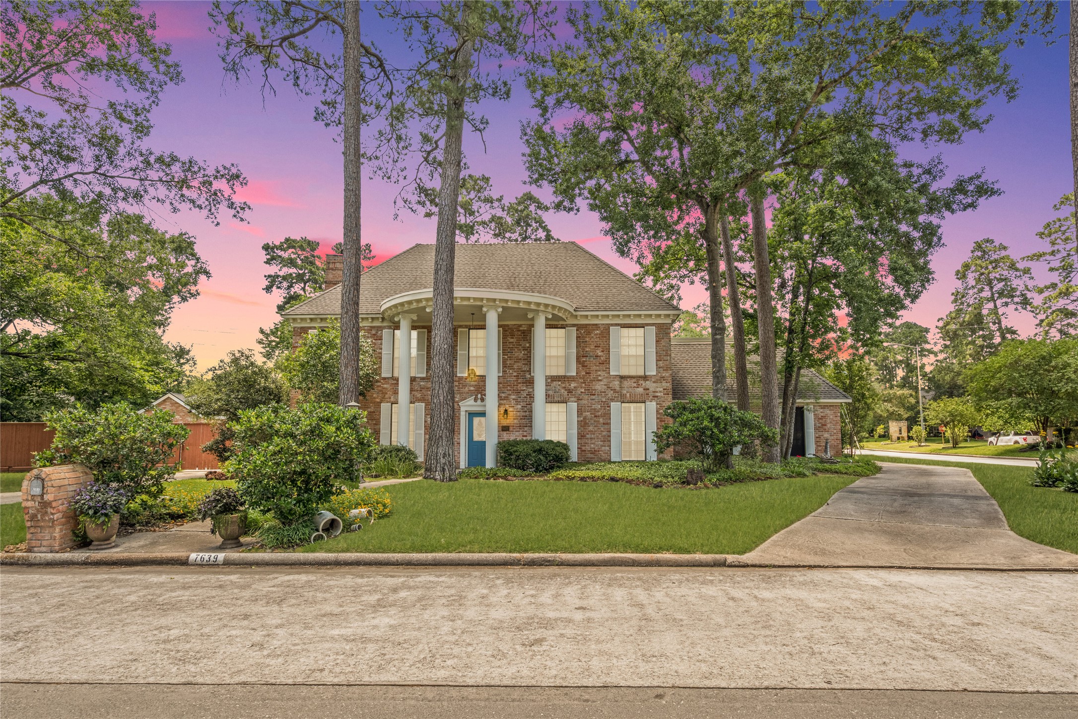 7639 Post Bridge Road Spring, TX 77389 - Photo 2 of 42 a front view of a house with a yard and potted plants