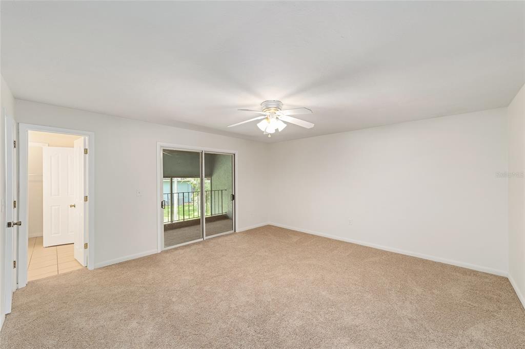 501 Southwest 75th Street, Unit H6 Gainesville, FL 32607 - Photo 27 of 42 a view of a livingroom with a ceiling fan and window