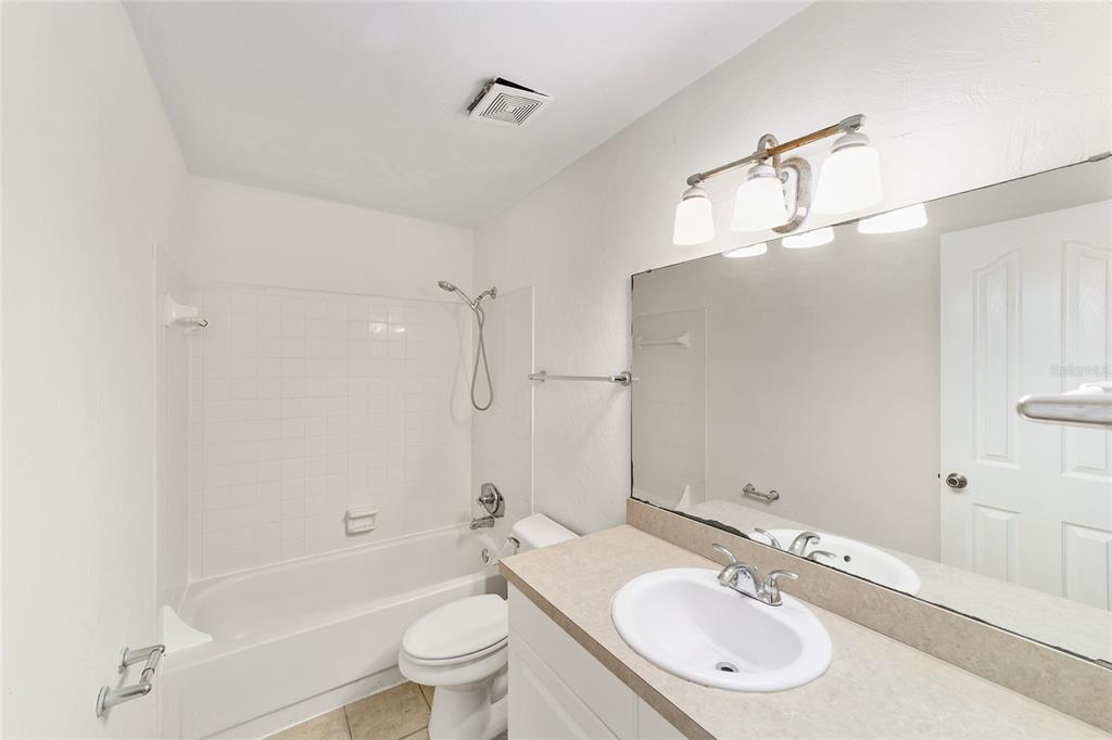 501 Southwest 75th Street, Unit H6 Gainesville, FL 32607 - Photo 32 of 42 a bathroom with a sink toilet tub and shower
