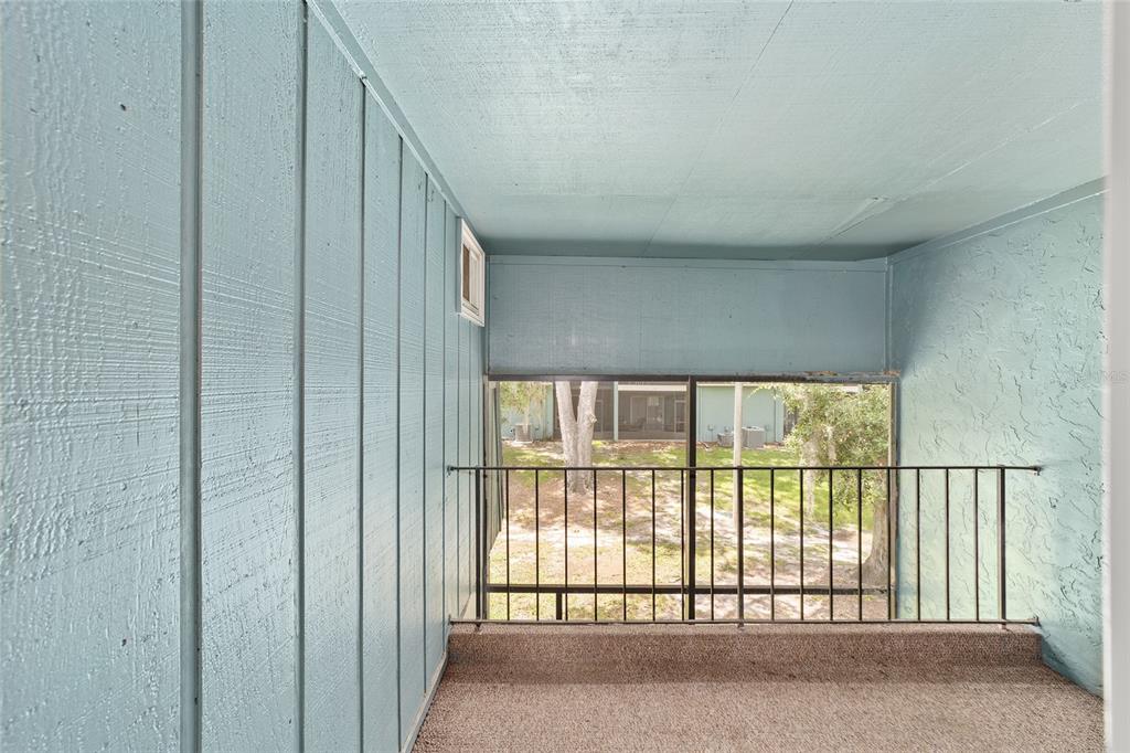501 Southwest 75th Street, Unit H6 Gainesville, FL 32607 - Photo 33 of 42 a view of an empty room with a large window