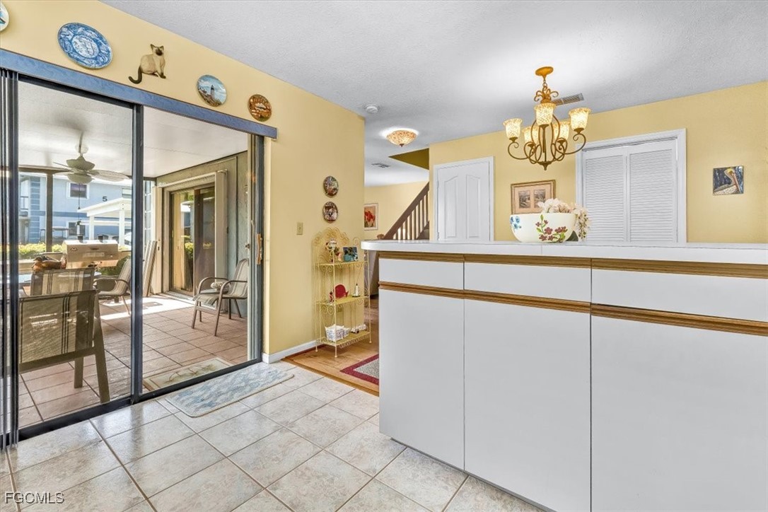 707 Hoover Dike Road, Unit 904 Clewiston, FL 33440 - Photo 13 of 38 a view of a hallway to a livingroom with furniture