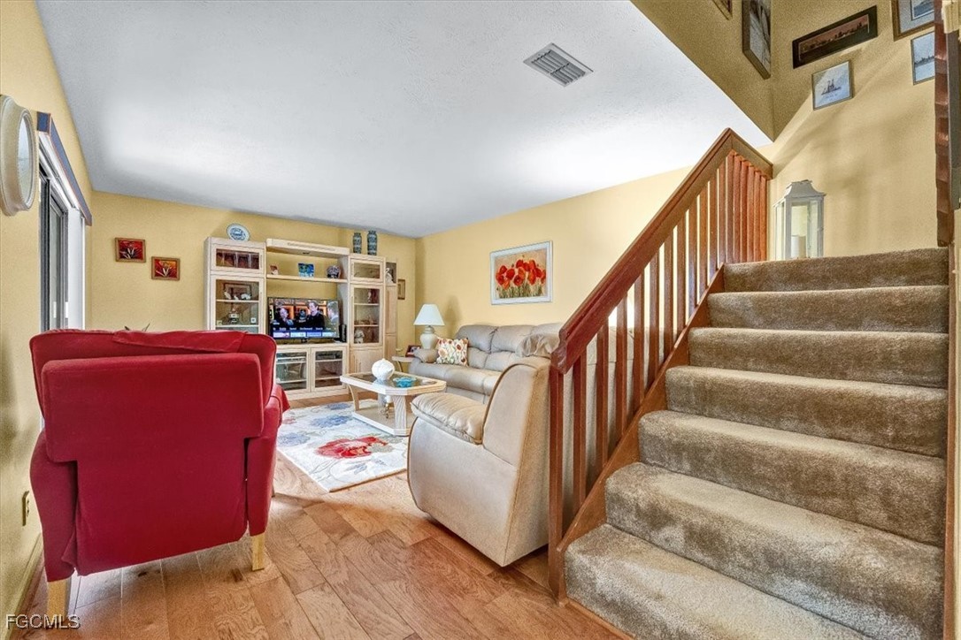 707 Hoover Dike Road, Unit 904 Clewiston, FL 33440 - Photo 18 of 38 a living room with furniture and a floor to ceiling window