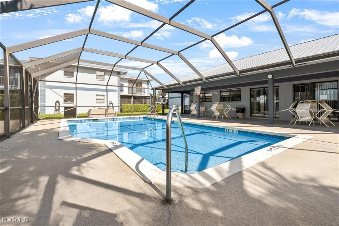707 Hoover Dike Road, Unit 904 Clewiston, FL 33440 - Photo 29 of 38 a view of a swimming pool with a patio