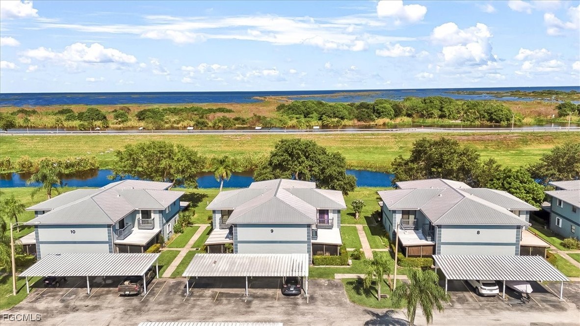 707 Hoover Dike Road, Unit 904 Clewiston, FL 33440 - Photo 35 of 38 a view of a city from a lake