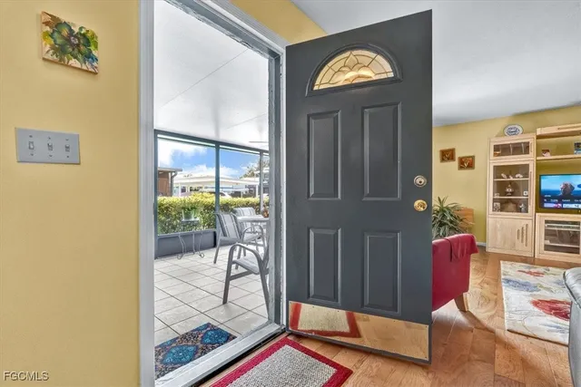 image of a livingroom with furniture and next to a window