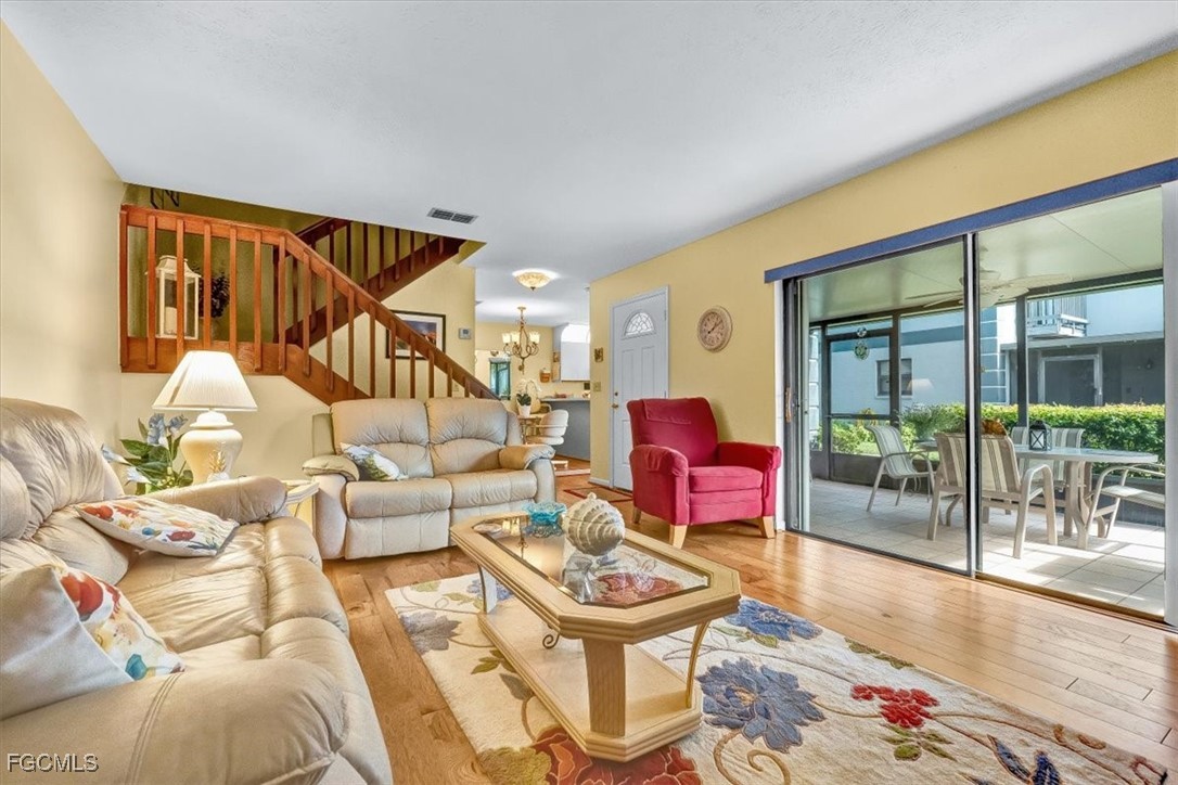 707 Hoover Dike Road, Unit 904 Clewiston, FL 33440 - Photo 6 of 38 a living room with furniture and a floor to ceiling window
