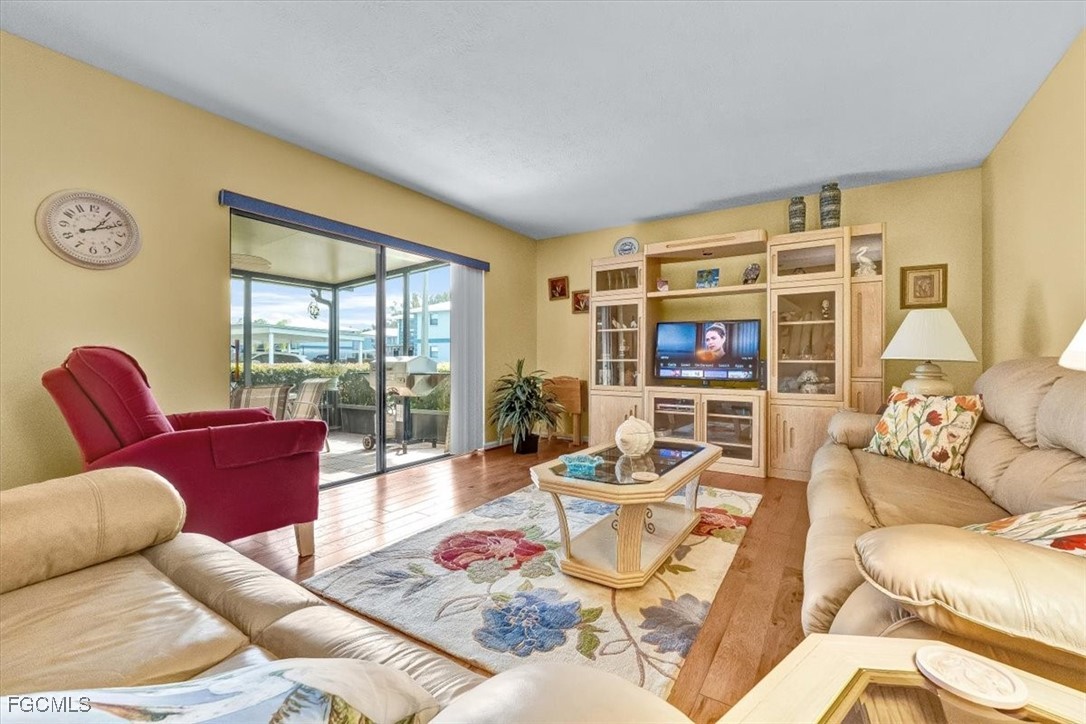 707 Hoover Dike Road, Unit 904 Clewiston, FL 33440 - Photo 7 of 38 a living room with furniture and a large window