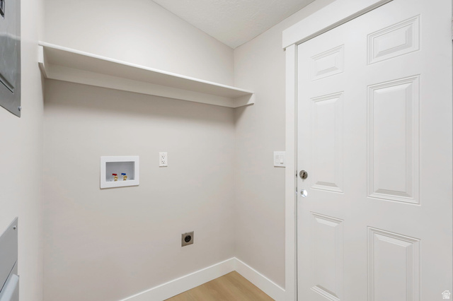 96 Barrington Way Layton, UT 84041 - Photo 13 of 28 Laundry area featuring light wood-type flooring, hookup for a washing machine, and hookup for an electric dryer