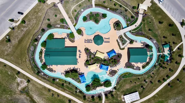 an aerial view of a house with a garden