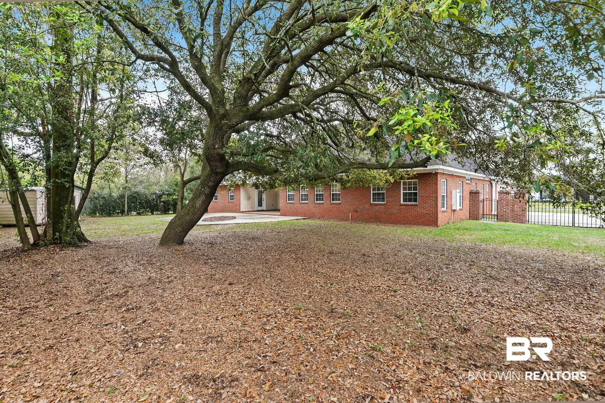 3668 Claridge Road North Mobile, AL 36608 - Photo 91 of 100 View of side of home with a patio area and brick siding