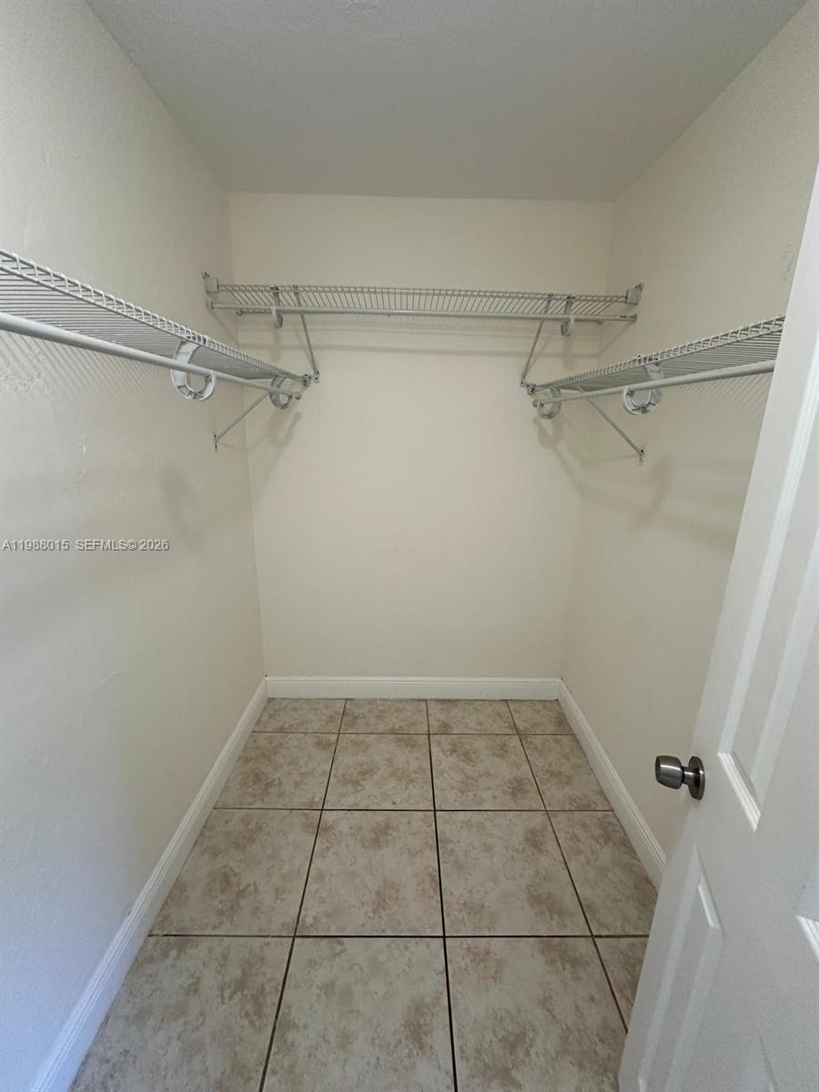 100 Northeast 78th Street, Unit 4 Miami, FL 33138 - Photo 11 of 12 a view of a room with racks on the wall