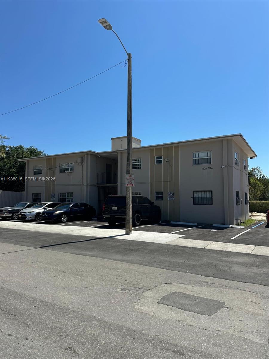 100 Northeast 78th Street, Unit 4 Miami, FL 33138 - Photo 4 of 12 a black car parked in front of a building