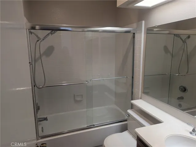 a bathroom with a shower and a toilet