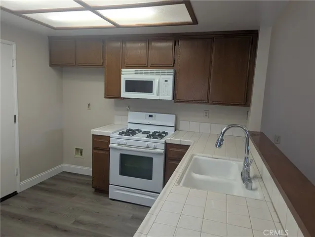a kitchen with a stove and a sink