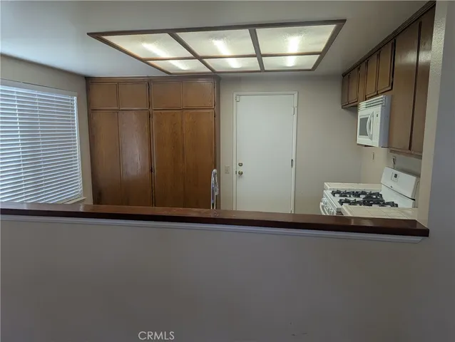 a front view of a house with swimming pool having outdoor seating