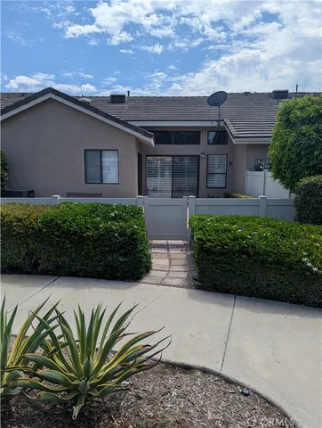 a house view with a garden space