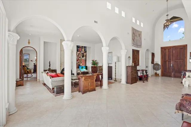 a living room with furniture and white walls