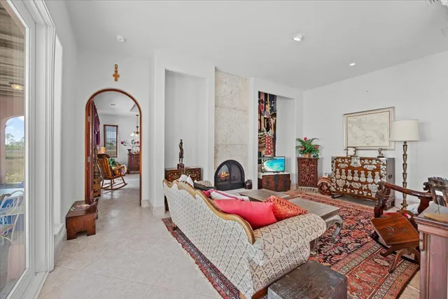 a living room with furniture and a fireplace