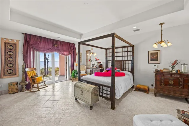 a bedroom with furniture and windows