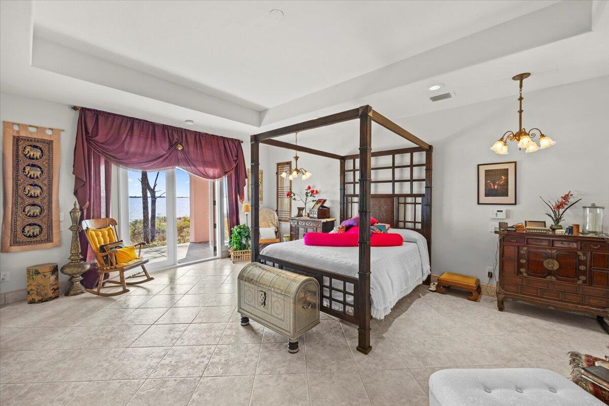 221 Wynnehaven Beach Road Mary Esther, FL 32569 - Photo 14 of 35 a bedroom with furniture and windows