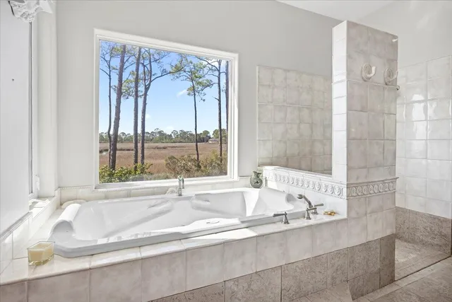a bath tub sitting next to a window