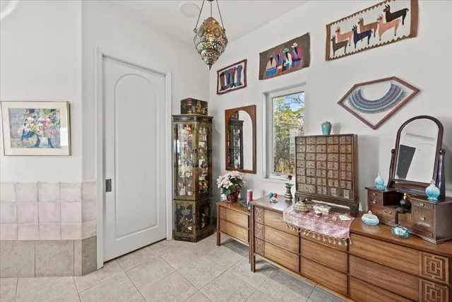 a view of hall way with furniture