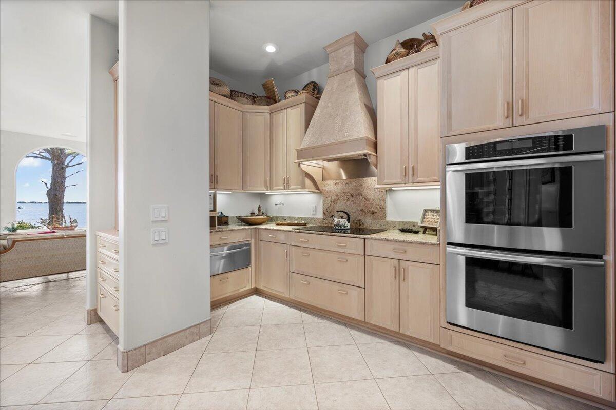 221 Wynnehaven Beach Road Mary Esther, FL 32569 - Photo 22 of 35 a kitchen with cabinets and appliances