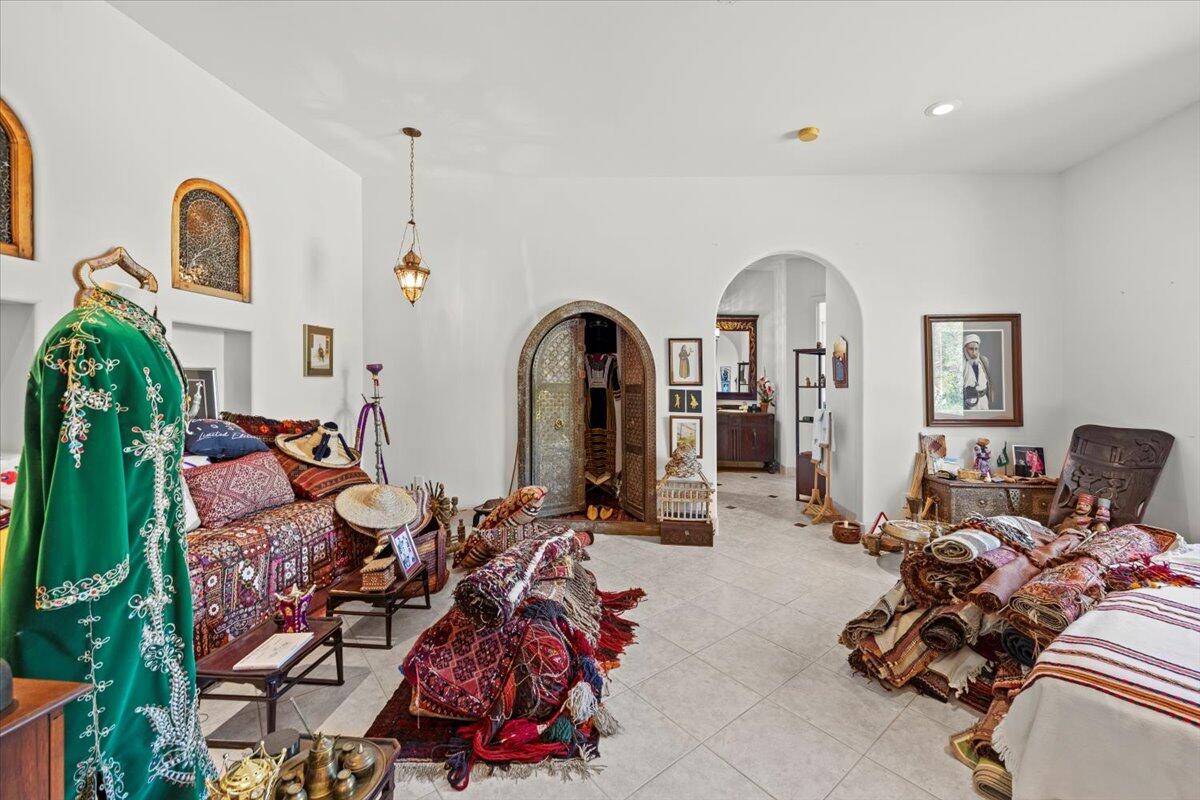 221 Wynnehaven Beach Road Mary Esther, FL 32569 - Photo 23 of 35 a living room with furniture a fireplace and potted plants