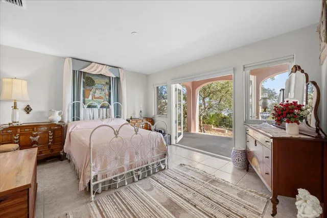 a bed room with a bed and a large window