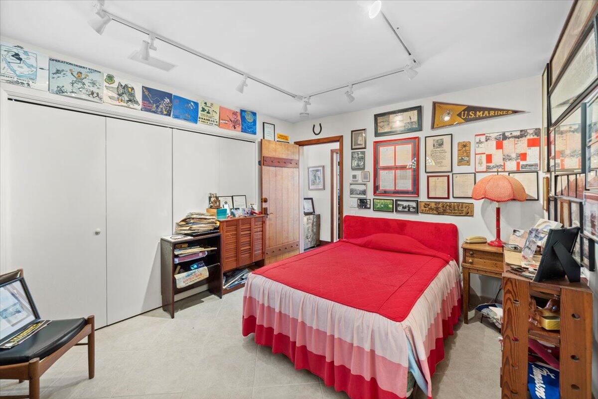 221 Wynnehaven Beach Road Mary Esther, FL 32569 - Photo 29 of 35 a bedroom with bed and a book shelf