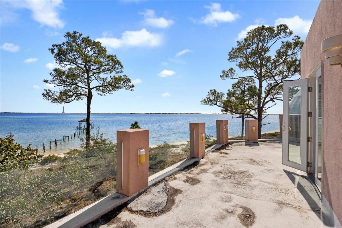221 Wynnehaven Beach Road Mary Esther, FL 32569 - Photo 32 of 35 a view of a lake with a mountain in the background