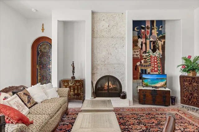 a living room with furniture and a fireplace