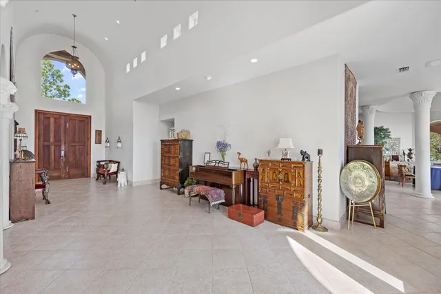 an entryway with a workspace and a couch