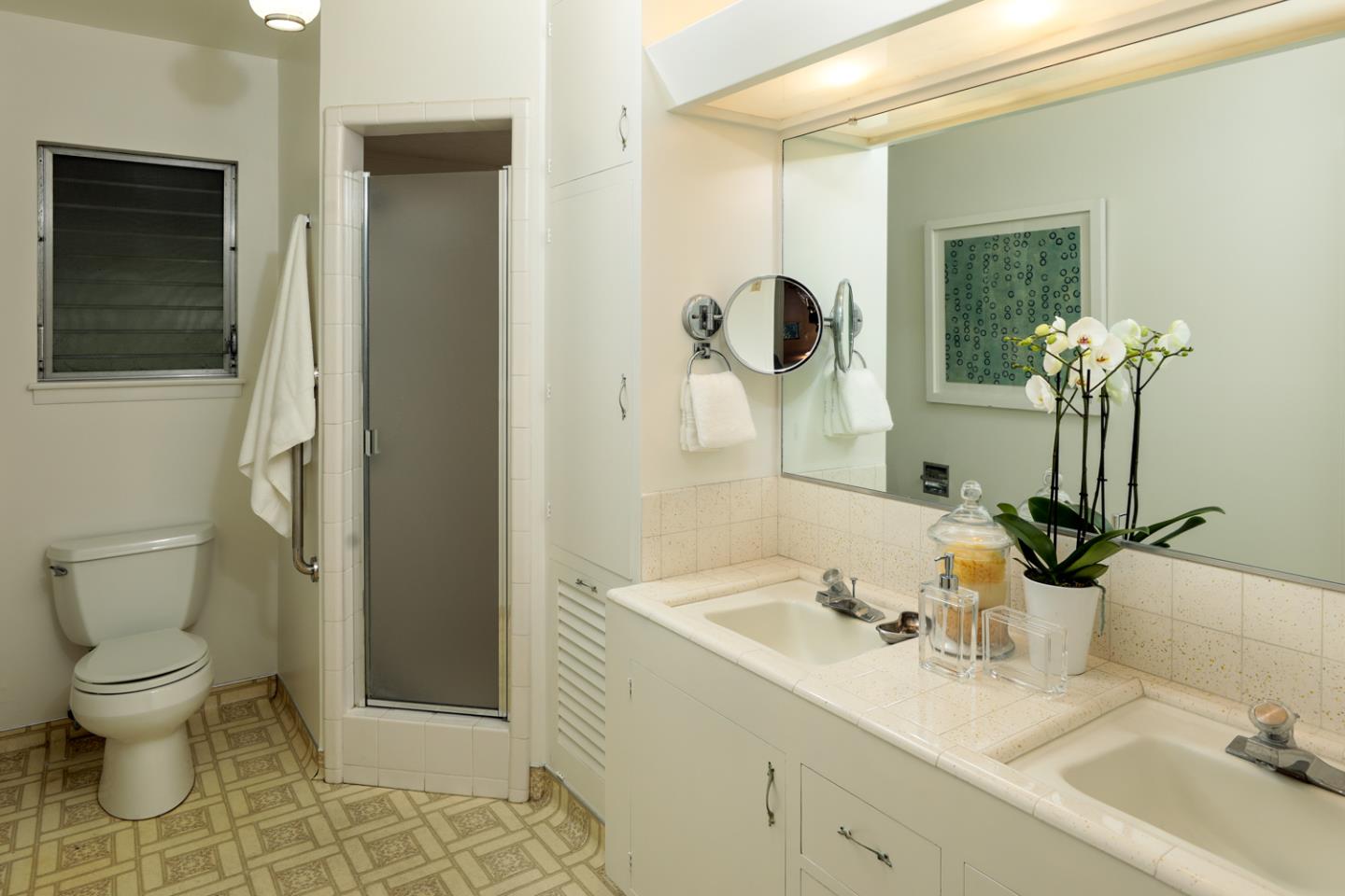 95 Mulberry Lane Atherton, CA 94027 - Photo 15 of 26 a bathroom with a sink and mirror with toilet