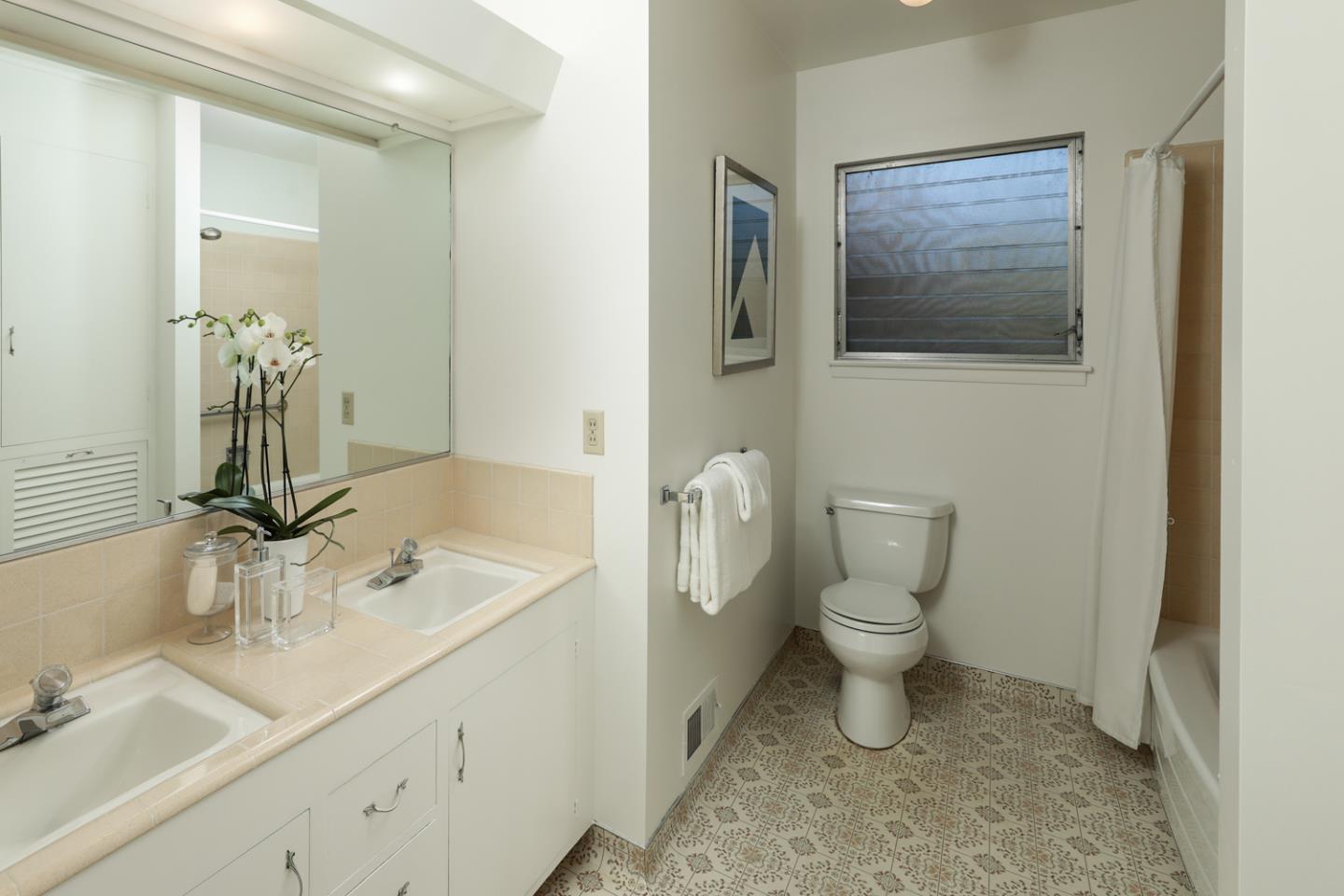 95 Mulberry Lane Atherton, CA 94027 - Photo 16 of 26 a bathroom with a toilet sink and mirror
