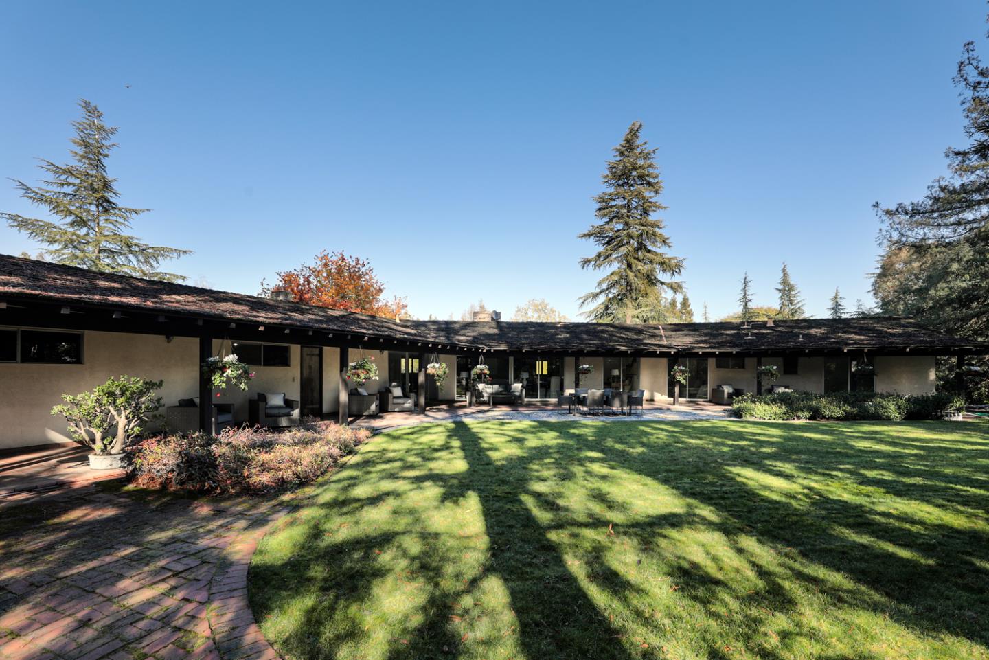 95 Mulberry Lane Atherton, CA 94027 - Photo 24 of 26 a view of swimming pool with outdoor seating and a garden