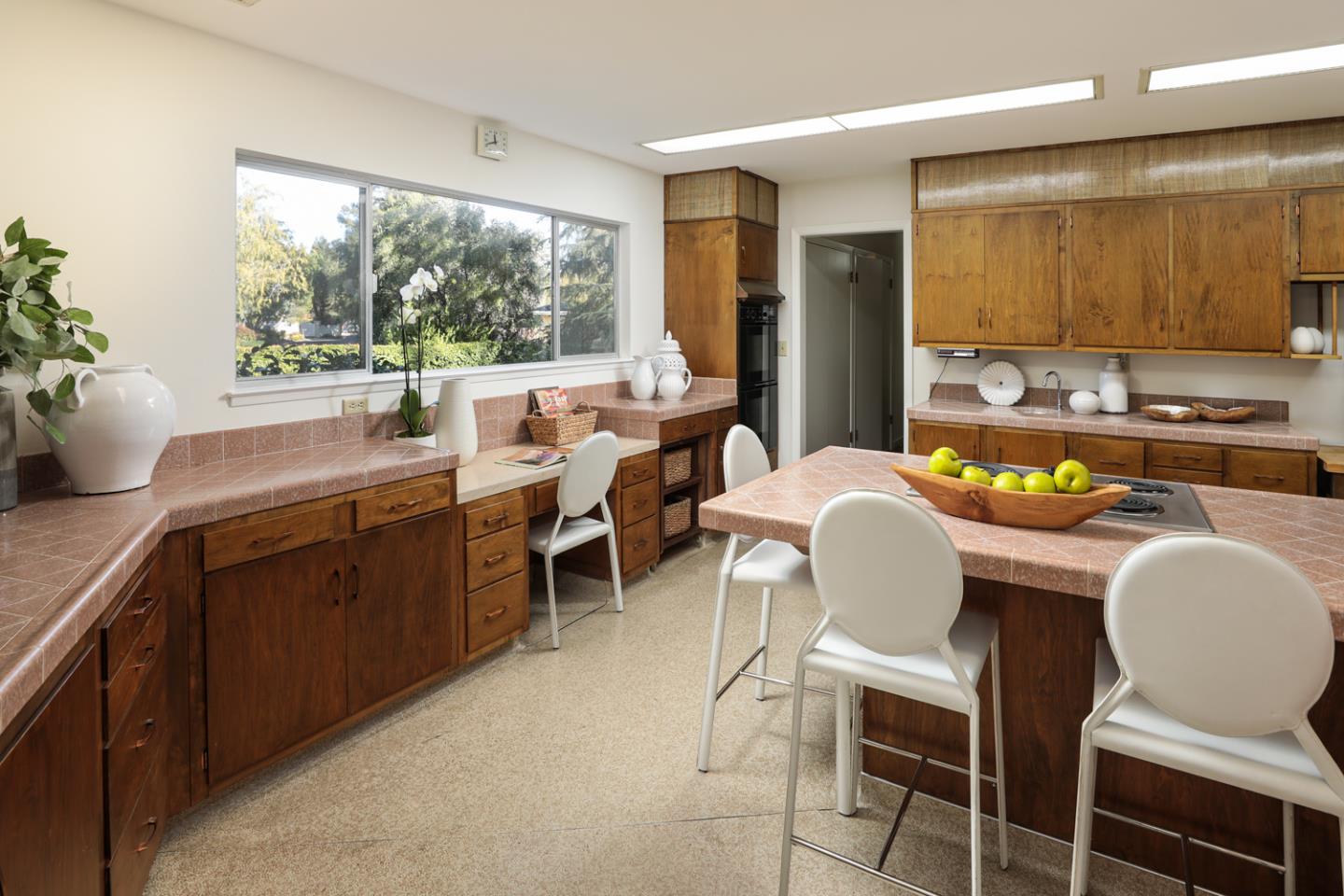 95 Mulberry Lane Atherton, CA 94027 - Photo 9 of 26 a dining room with a large window and chairs