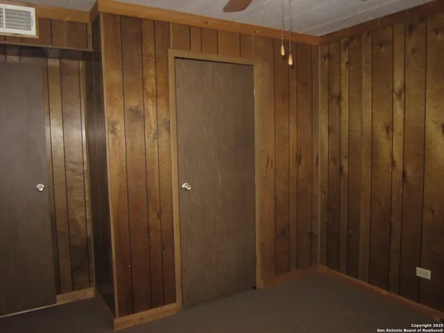 a bathroom with a shower and a door