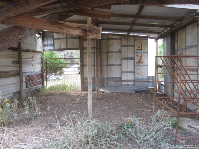 a view of a room with wooden walls