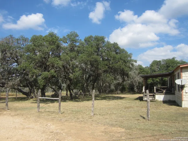 a swimming pool with some trees in the background