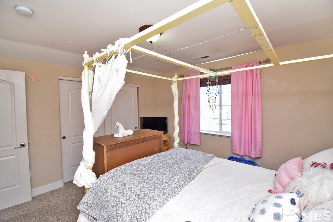 2735 Gulling Court Reno, NV 89503 - Photo 23 of 30 a bedroom with a bed and a window