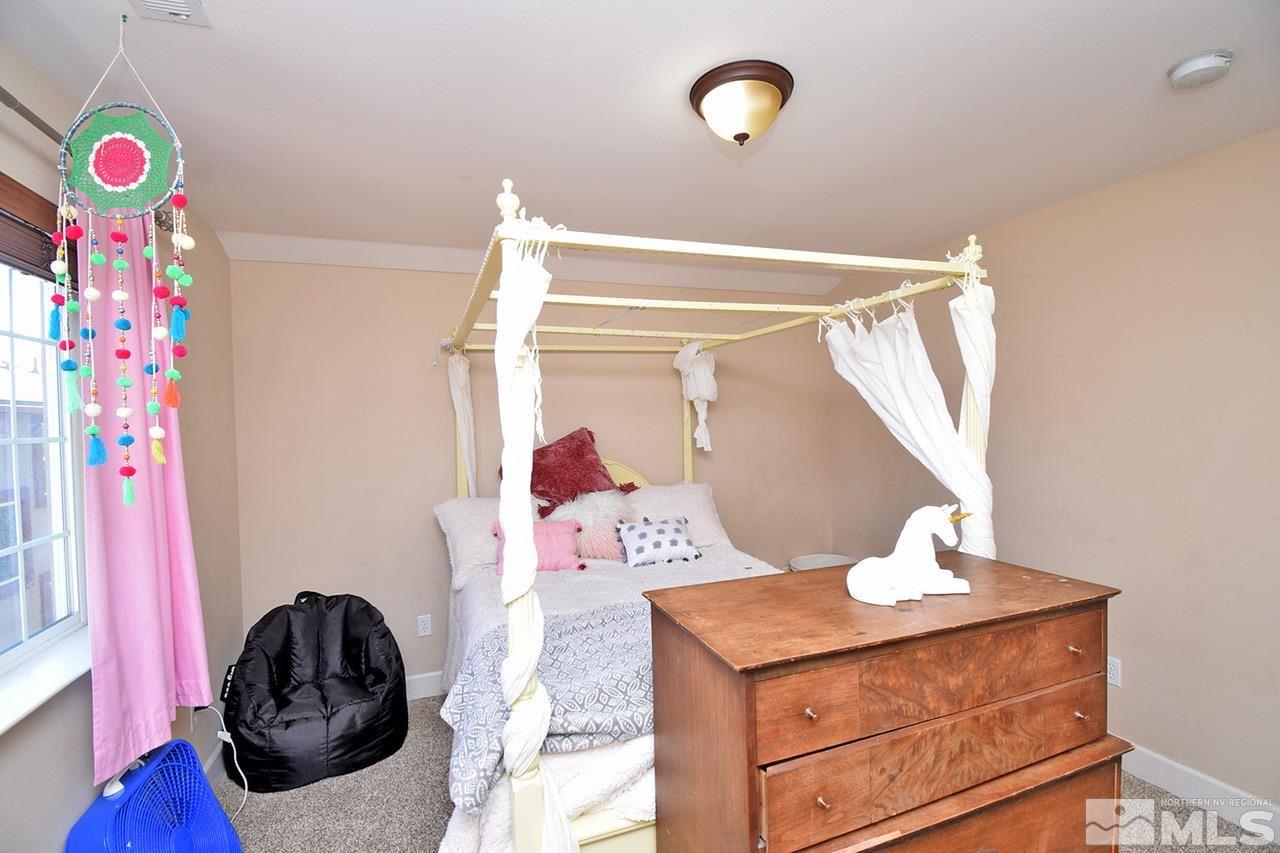 2735 Gulling Court Reno, NV 89503 - Photo 24 of 30 a bedroom with a bed and a dresser