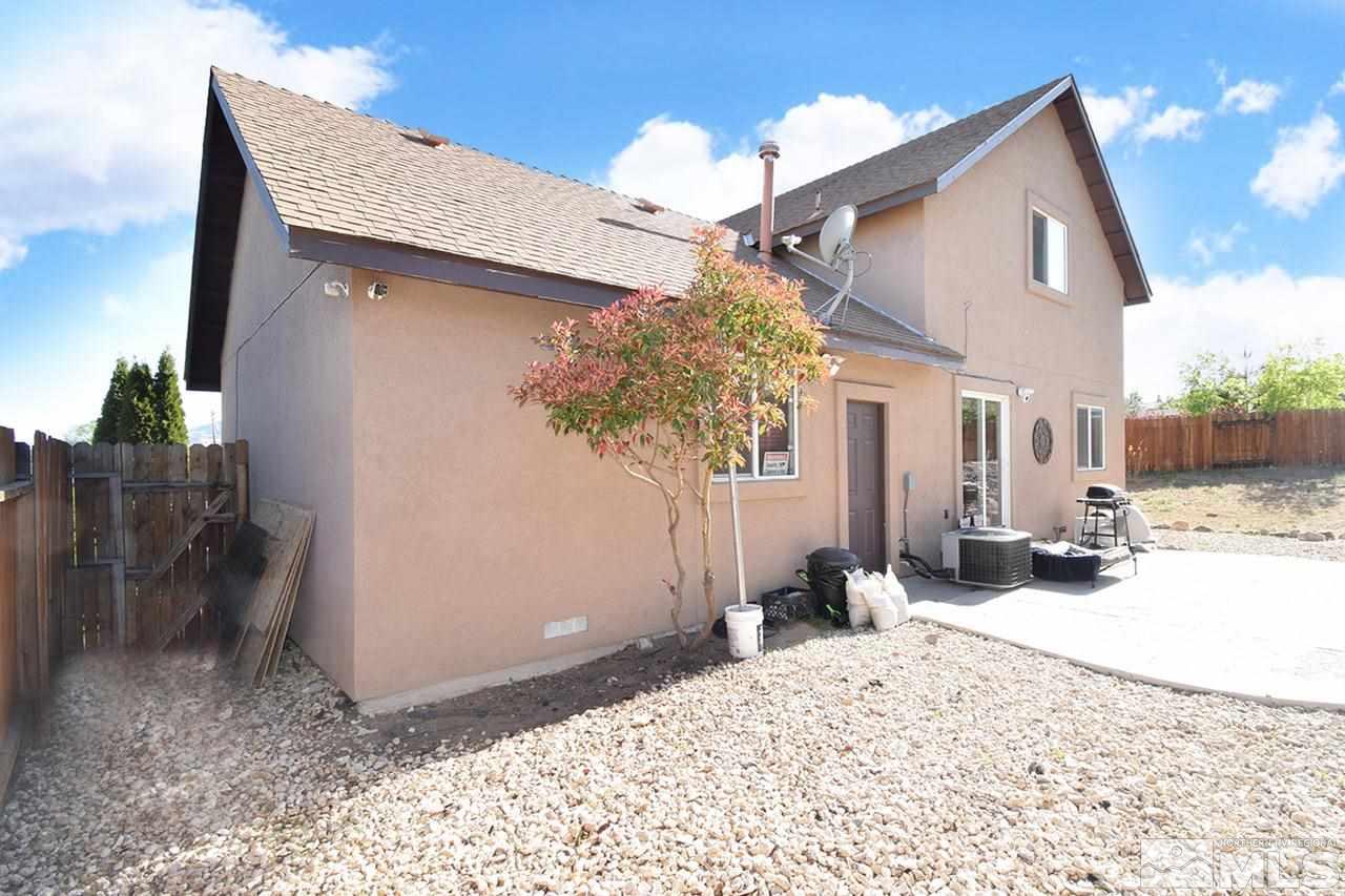 2735 Gulling Court Reno, NV 89503 - Photo 27 of 30 a view of a house with a yard and chandelier