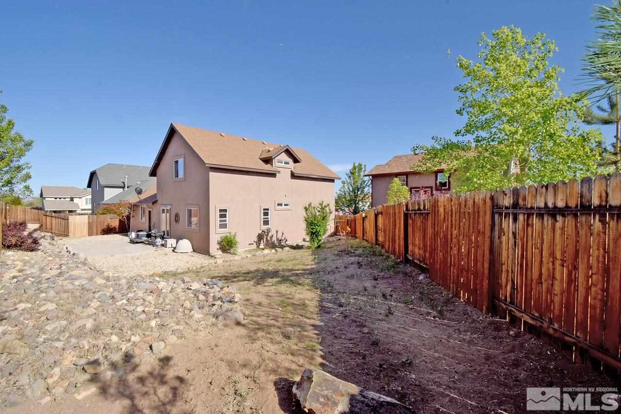 2735 Gulling Court Reno, NV 89503 - Photo 29 of 30 a view of a backyard with wooden fence