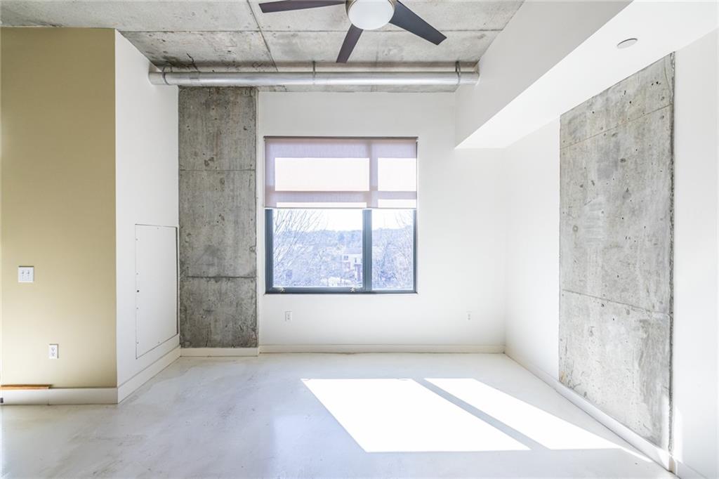 335 West Ponce De Leon Avenue, Unit 506 Decatur, GA 30030 - Photo 14 of 49 an empty room with a empty space and windows