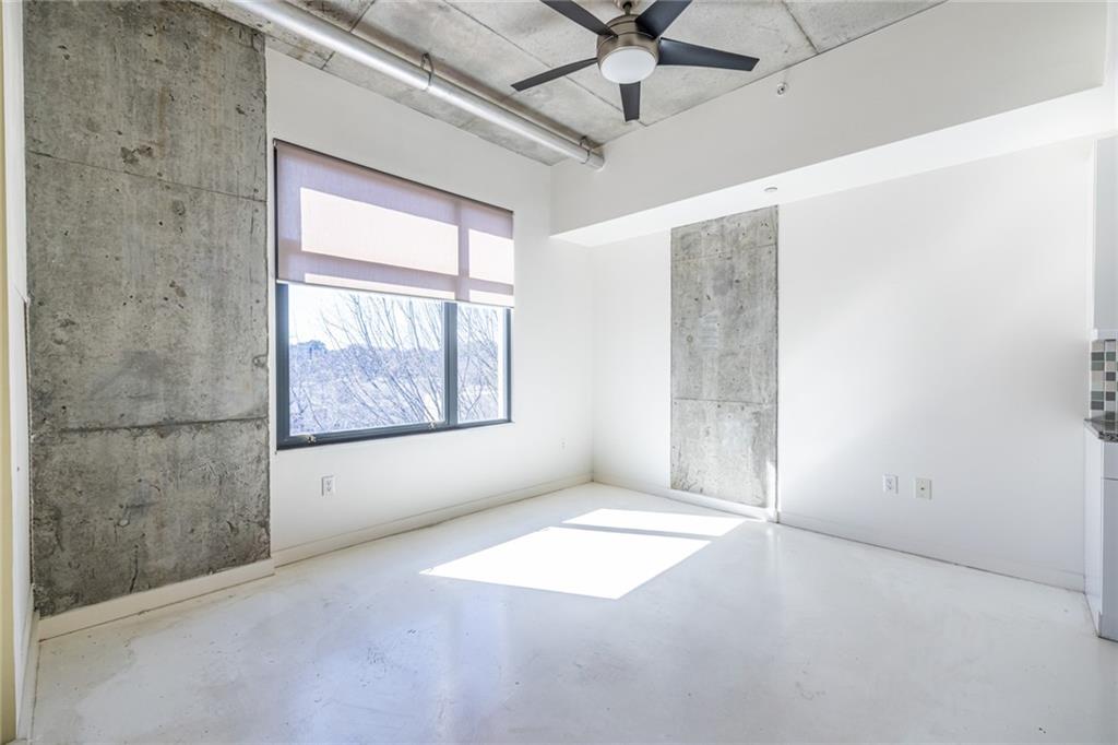 335 West Ponce De Leon Avenue, Unit 506 Decatur, GA 30030 - Photo 15 of 49 an empty room with windows and fan